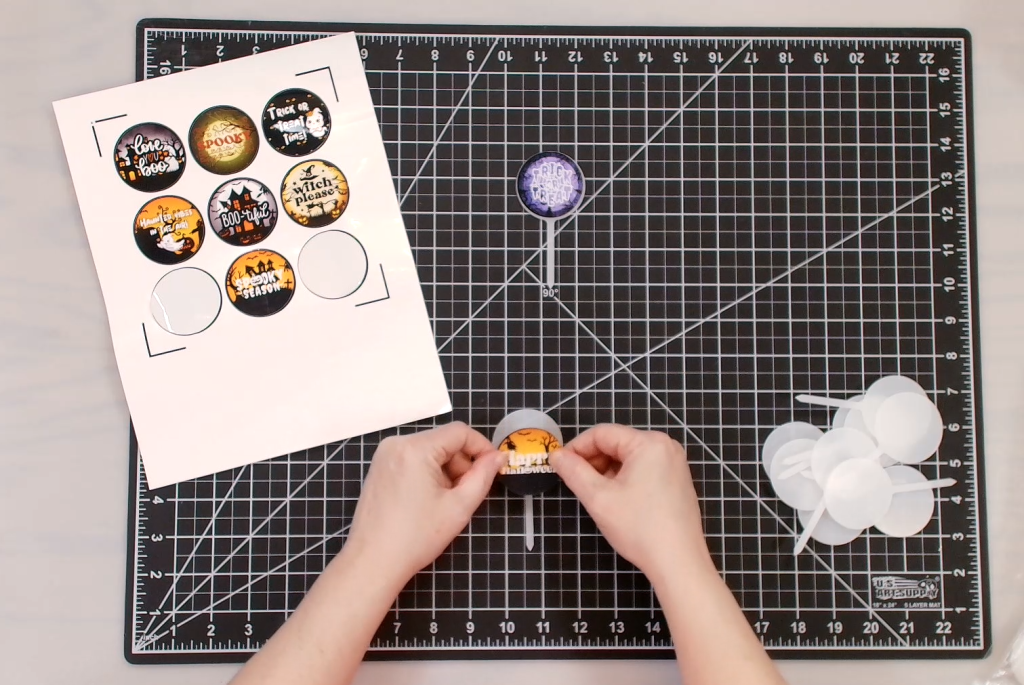 place the stickers on your cupcake toppers
